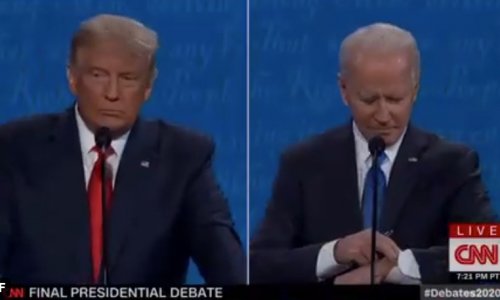Cúi xuống nhìn đồng hồ, Joe Biden đã mắc sai lầm chết người trong cuộc tranh luận với TT Trump
